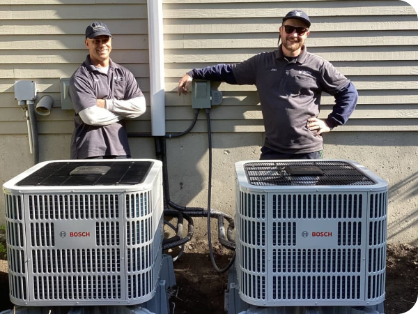 Caron installers with two newly installed Bosch heat pump condensers