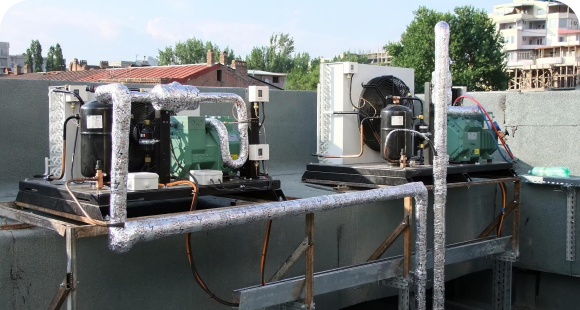 Heat pump condenser units on a commercial rooftop