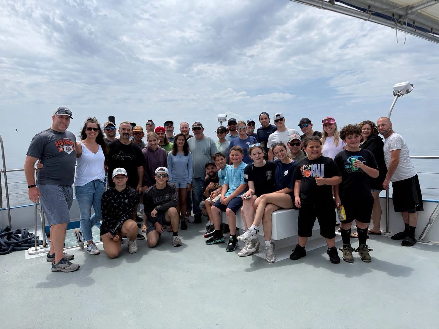 The Caron Heating & Cooling team and their families on their summer 2026 fishing outing