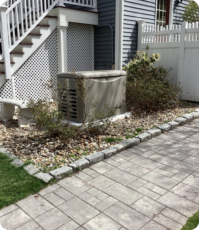 Whole-home standby generator installed by Caron Heating & Cooling at a Merrimack Valley home