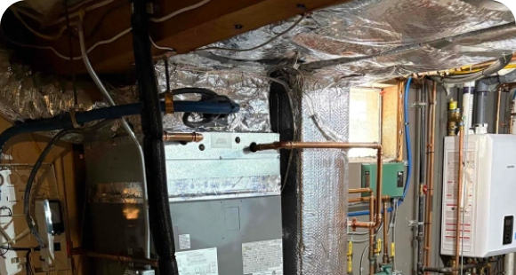 Navien tankless water heater installed by Caron Heating & Cooling in a Massachusetts basement