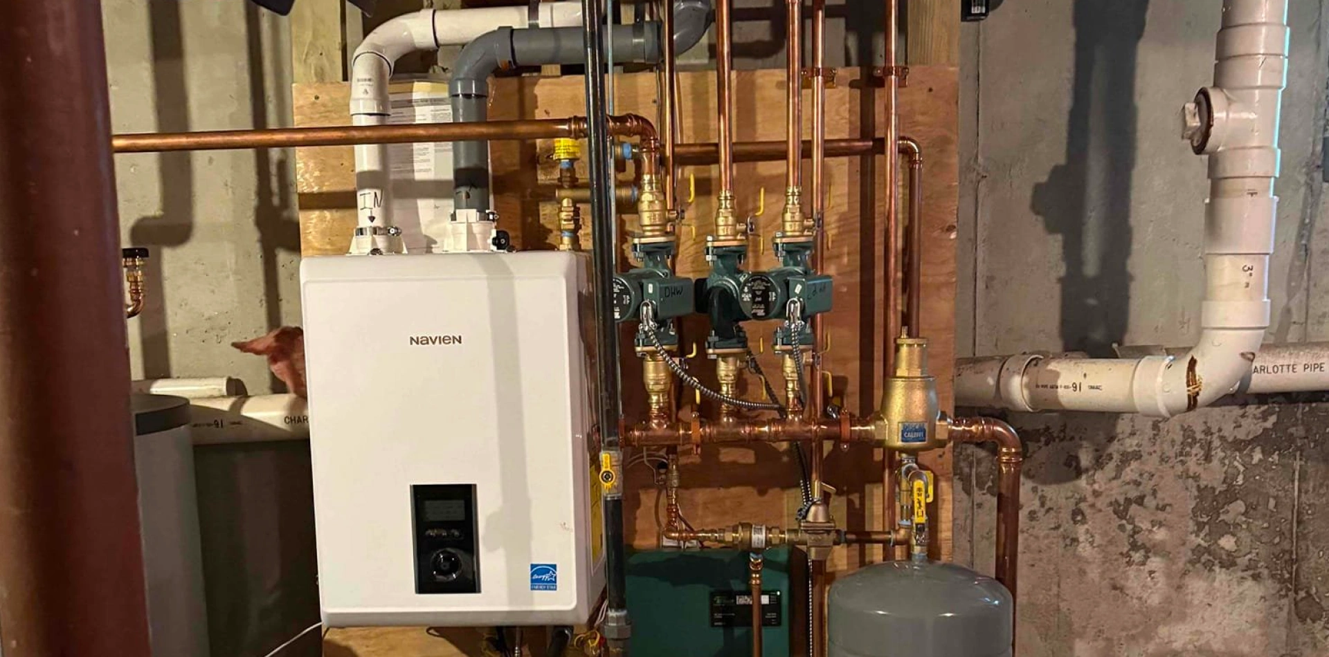 Navien combi boiler and near-boiler piping installed by Caron Heating & Cooling in a Merrimack Valley home"Boiler Installation & Replacement