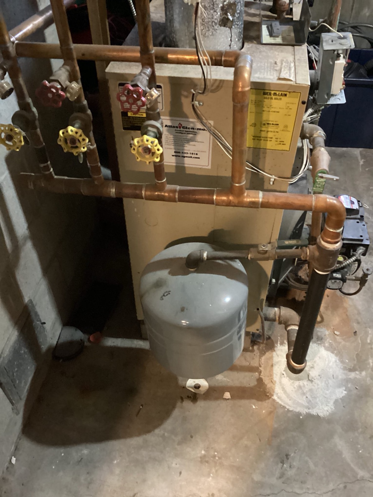 Cast-iron boiler with new copper near-boiler piping installed by Caron Heating & Cooling in Massachusetts